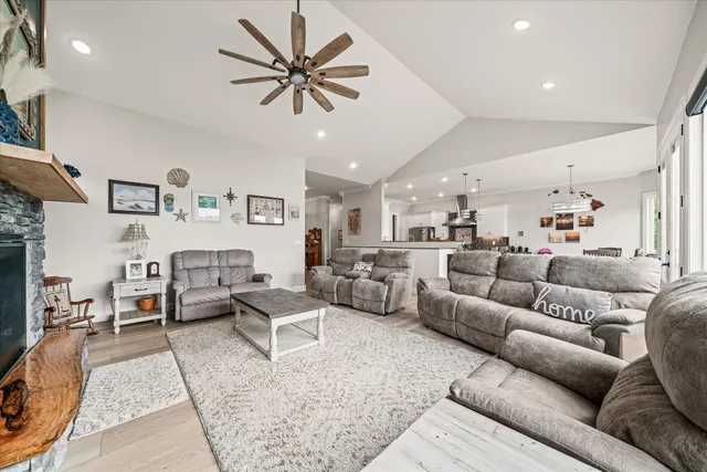 a spacious bedroom with a bed a couch and dresser