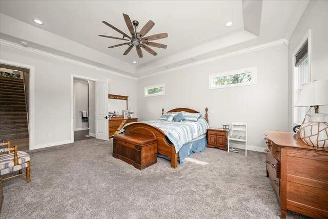 an aerial view of a house with a yard and lake view