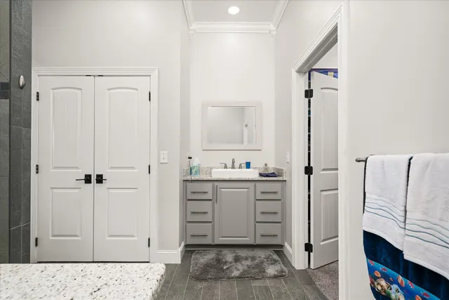 a view of house with garden and tall trees