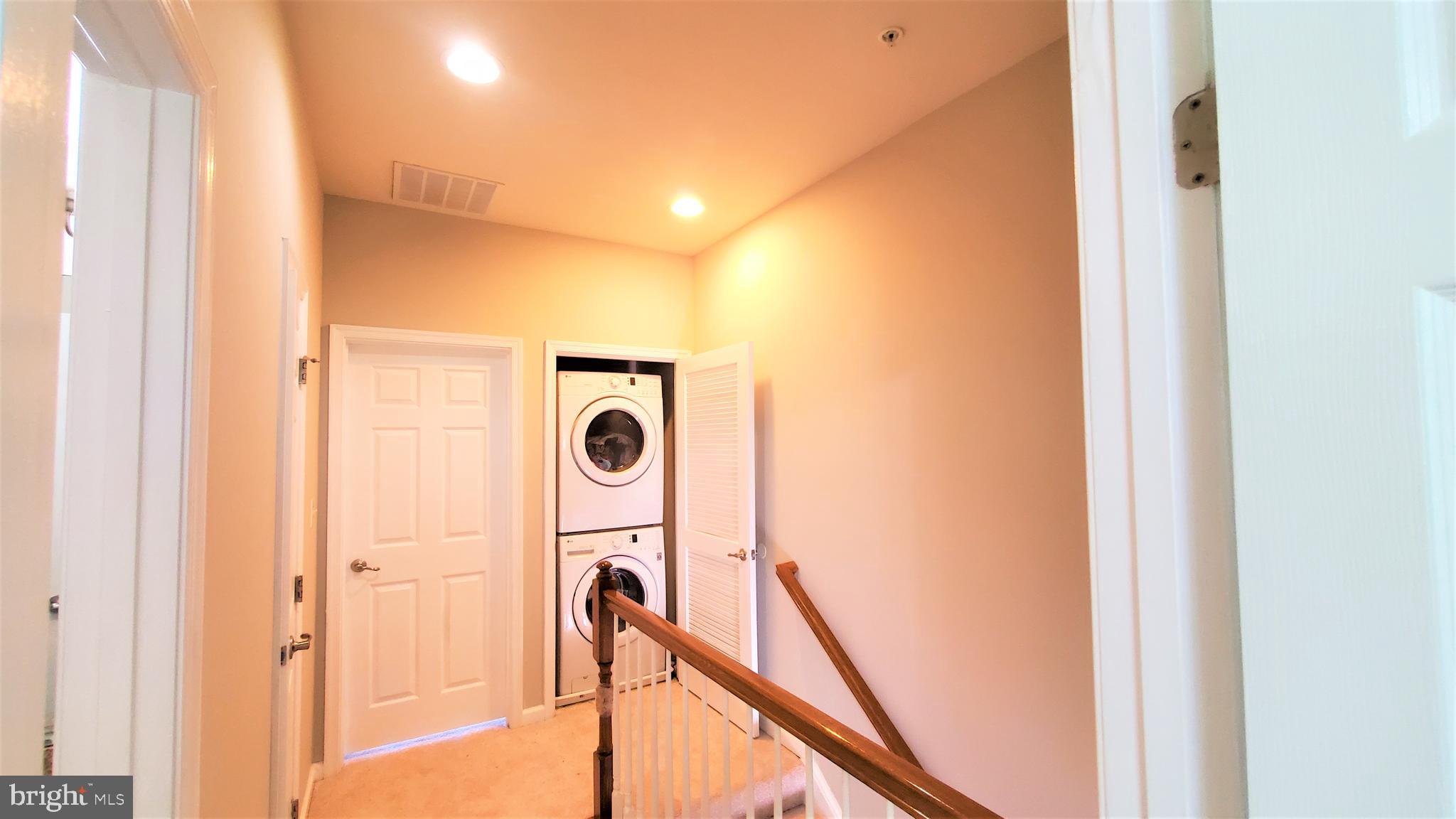 7206 Abbey Road Elkridge, MD 21075 - Photo 31 of 44 Hallway at upper level -stacked washer and dryer