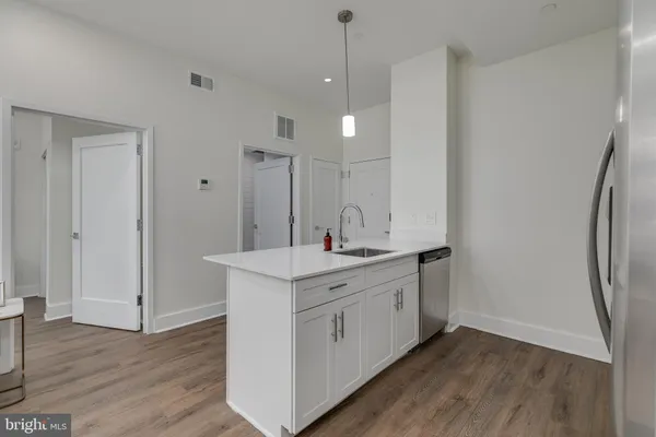 a bathroom with a double vanity sink and mirror