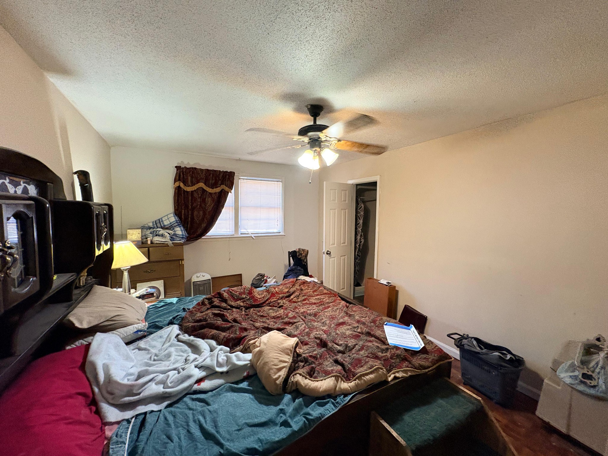 535 Inver Lane Clarksville, TN 37042 - Photo 6 of 10 a bedroom with a bed and a chandelier