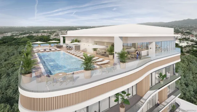 swimming pool view with a seating space