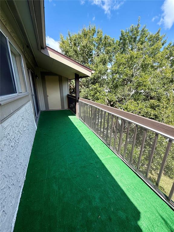 6306 Newtown Circle, Unit 6C5 Tampa, FL 33615 - Photo 22 of 24 a view of a porch with a yard