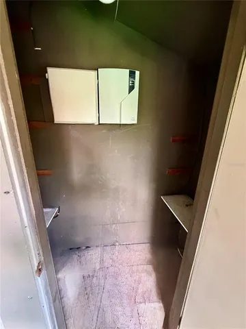 a view of an empty room and a window