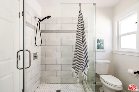 a bedroom with bed and window