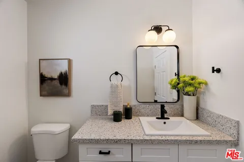 a view of a chairs and table in the patio