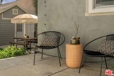 a swimming pool with outdoor seating and yard