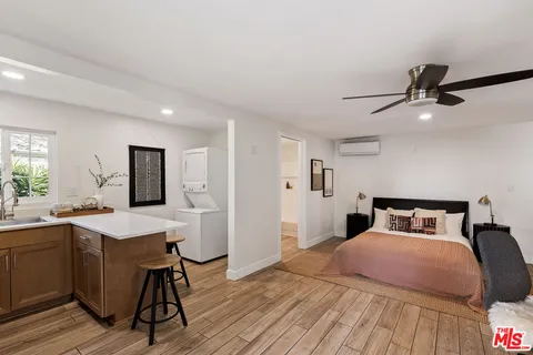 a kitchen with a sink appliances and cabinets