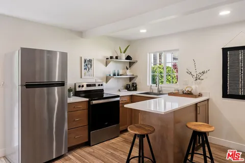 a kitchen with a sink and a window