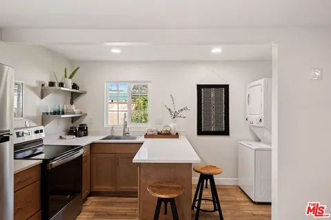 a bedroom with a bed a desk and chair