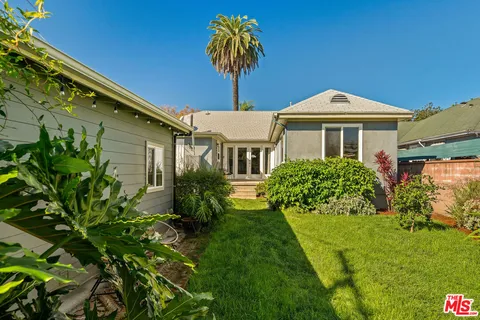 a house view with a garden space