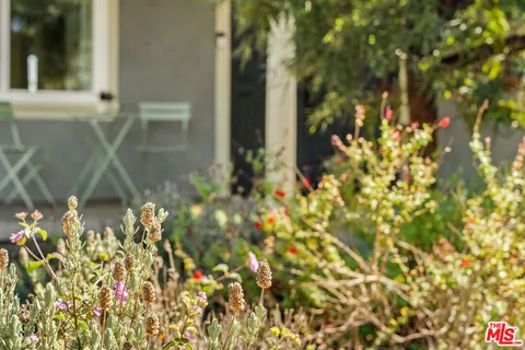 a living room with furniture fireplace and rug