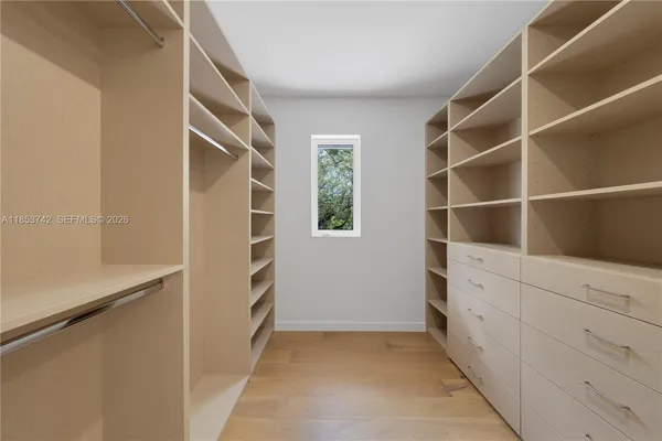 a view of an empty walk in closet