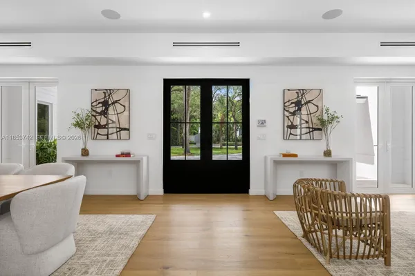 a living room with a couch and a large window