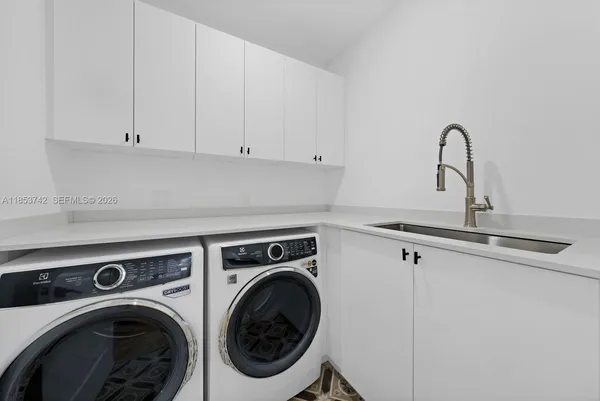 a view of storage and utility room with washer and dryer