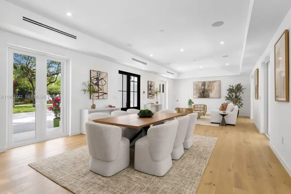 a living room with fireplace furniture and a table