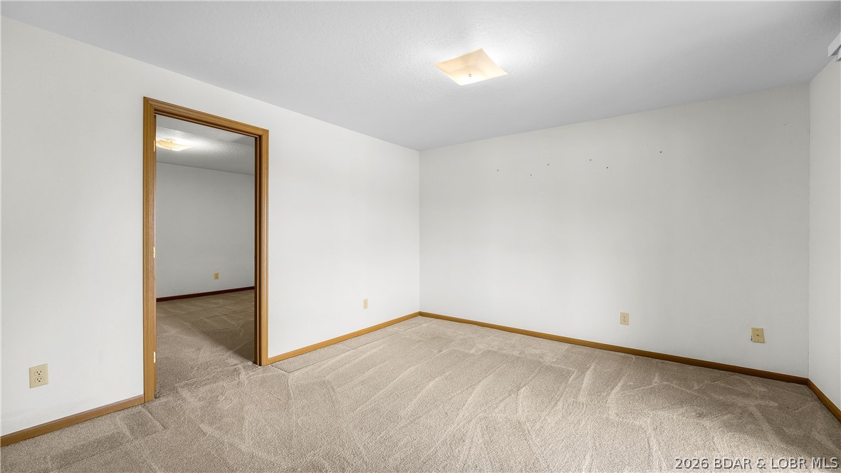 108 River Wood Road Camdenton, MO 65020 - Photo 19 of 32 3rd bedroom with slider access to the large deck o