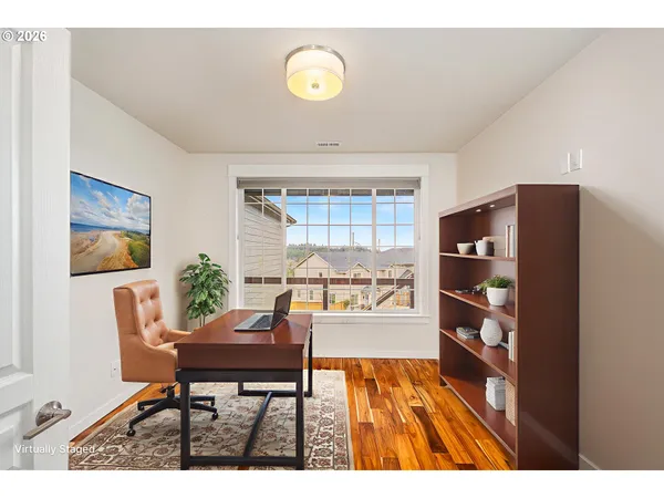 a workspace with furniture and a window