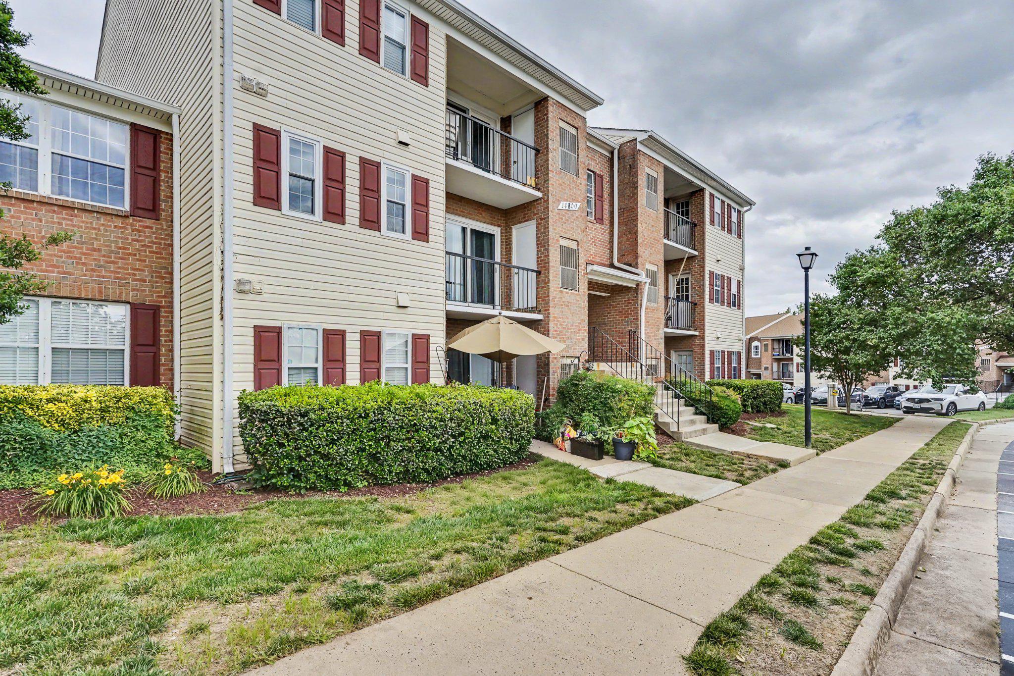 14800 Rydell Road, Unit 201 Centreville, VA 20121 - Photo 27 of 28 Charming condo complex with greenery.