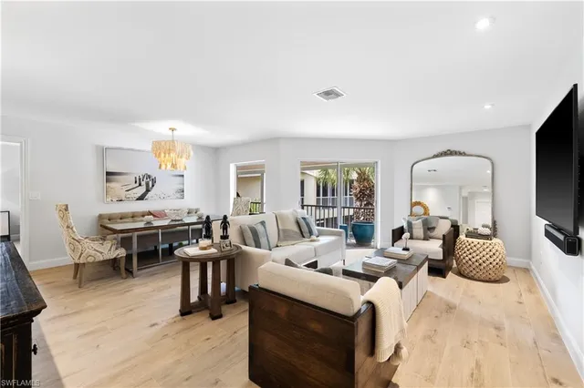 a living room with lots of furniture and a flat screen tv