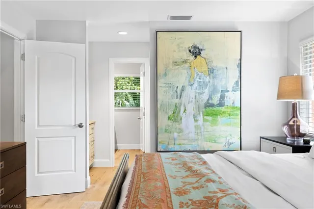 a bed room with a bed and a window