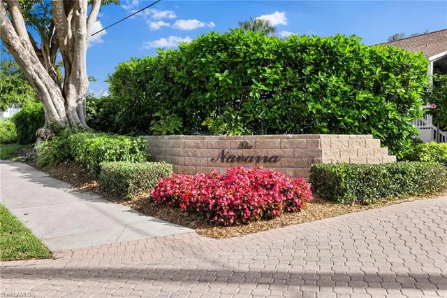 a view of a fountain in front of a house