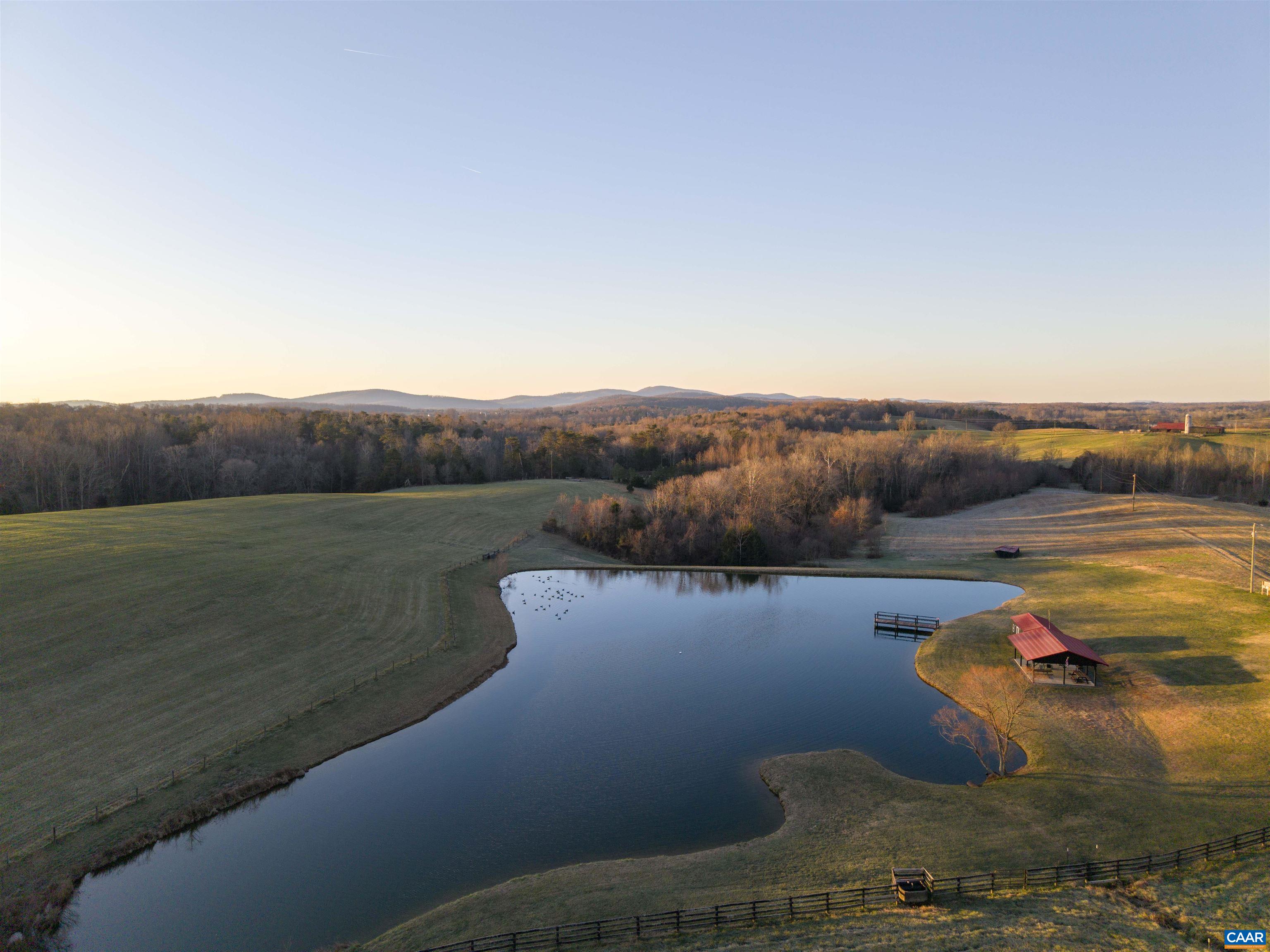 2427 South Blue Ridge Turnpike South Rochelle, VA 22738 - Photo 20 of 72 a view of a lake with a mountain in the background