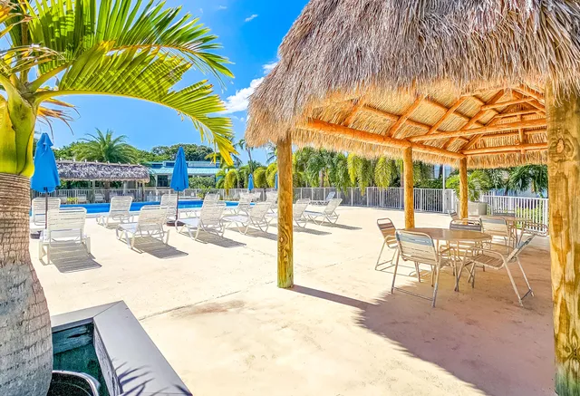 a view of a patio with swimming pool