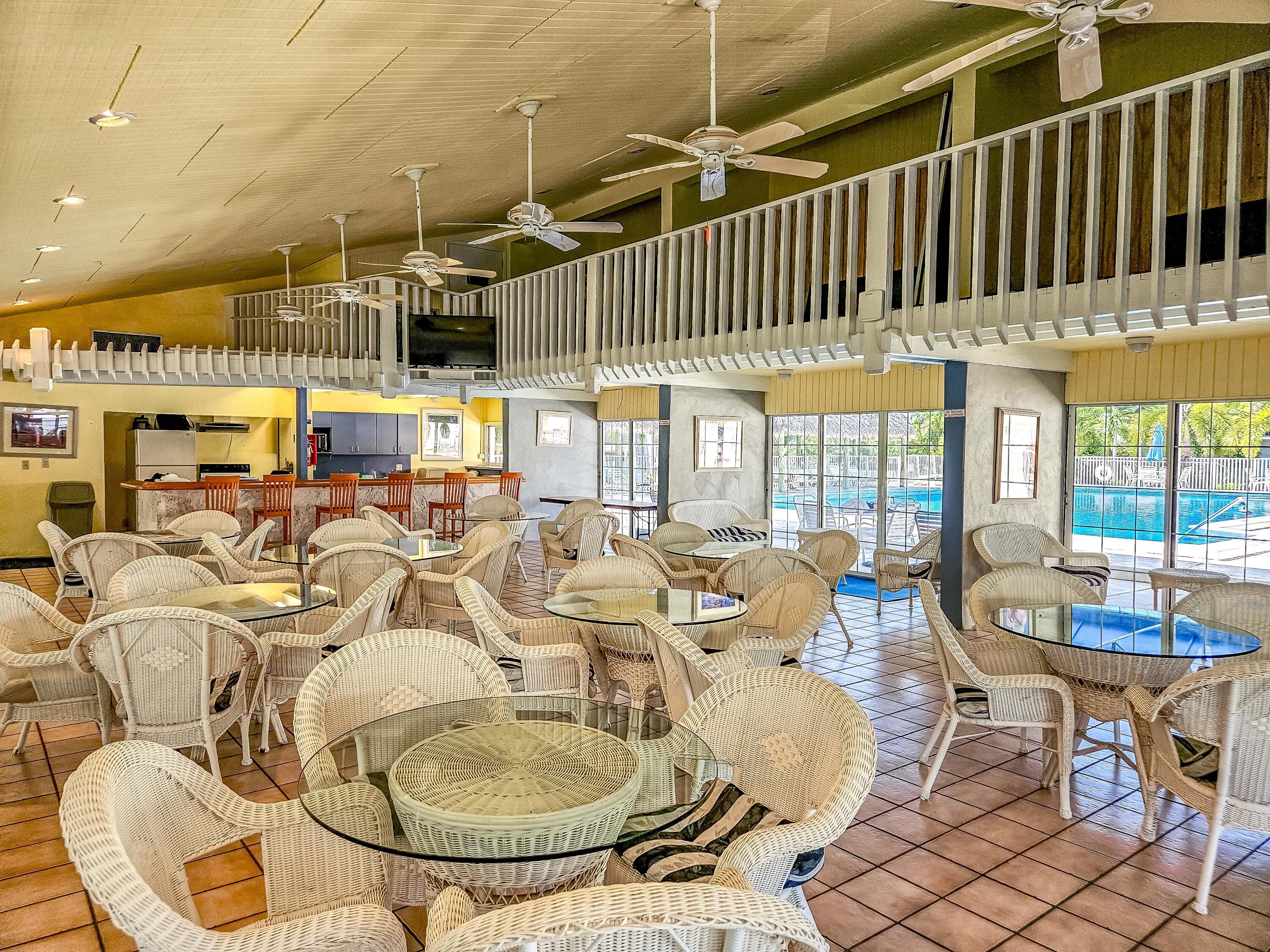 87200 Overseas Highway, Unit G5 Islamorada, FL 33036 - Photo 20 of 21 a dining room with furniture