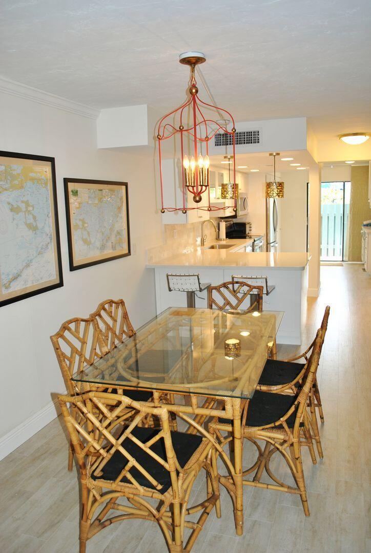 87200 Overseas Highway, Unit G5 Islamorada, FL 33036 - Photo 2 of 21 a dining room with furniture and view kitchen