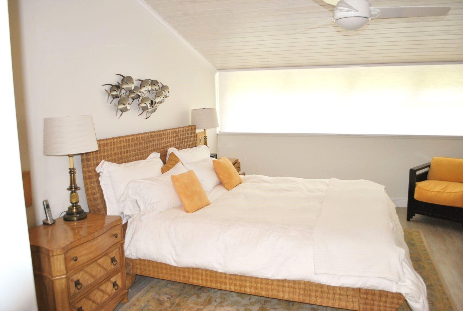 87200 Overseas Highway, Unit G5 Islamorada, FL 33036 - Photo 8 of 21 a bedroom with a bed and a night stand