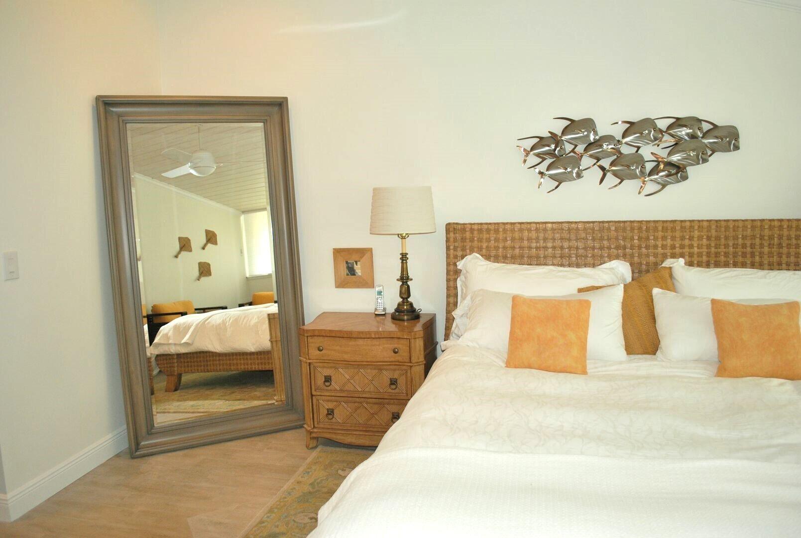 87200 Overseas Highway, Unit G5 Islamorada, FL 33036 - Photo 9 of 21 a bedroom with a large bed and a couch