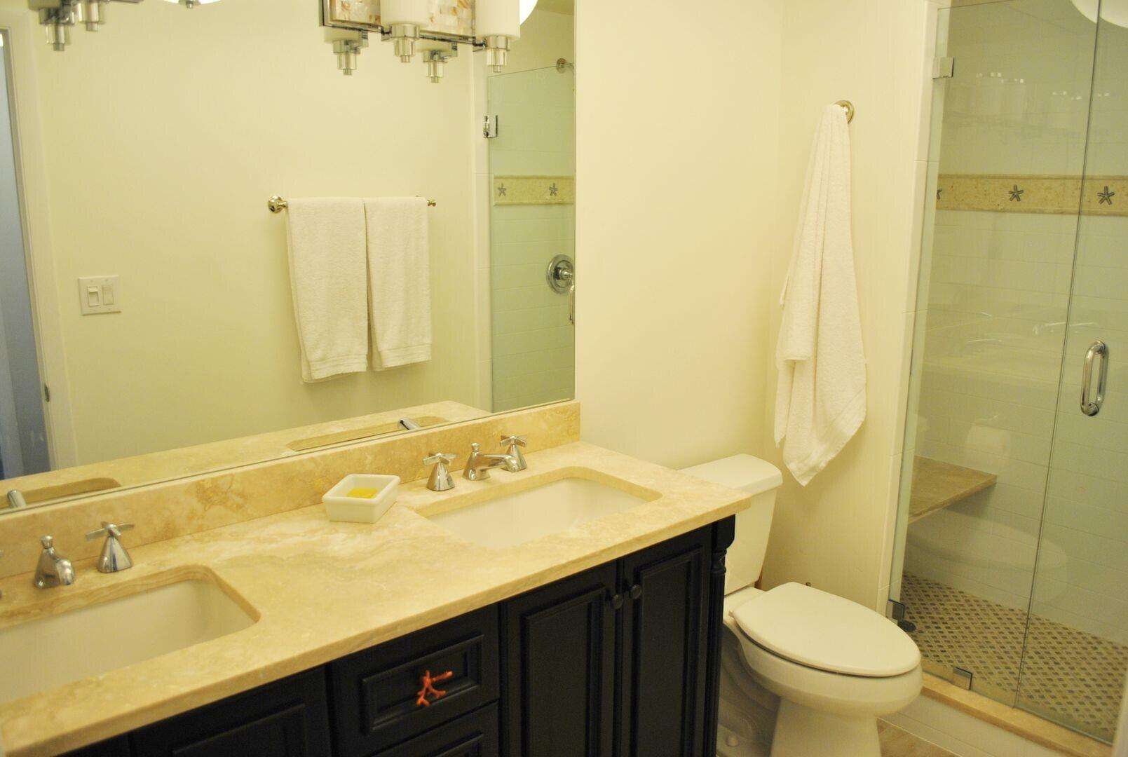 87200 Overseas Highway, Unit G5 Islamorada, FL 33036 - Photo 10 of 21 a bathroom with a sink and a mirror