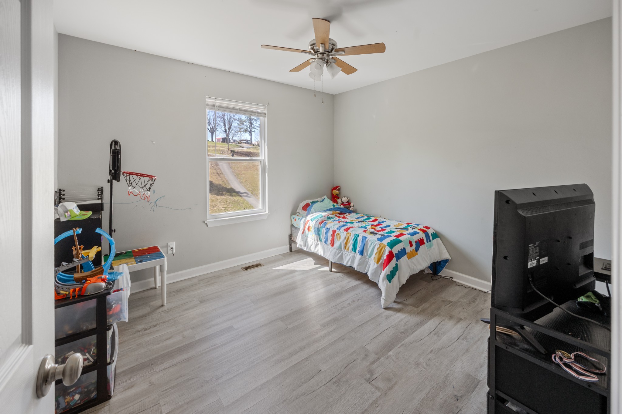 510 Highland Park Road Red Boiling Springs, TN 37150 - Photo 12 of 21 a bedroom with a bed and a wooden floor
