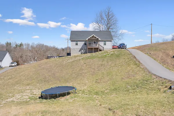 a yellow tub sitting in the middle of a field