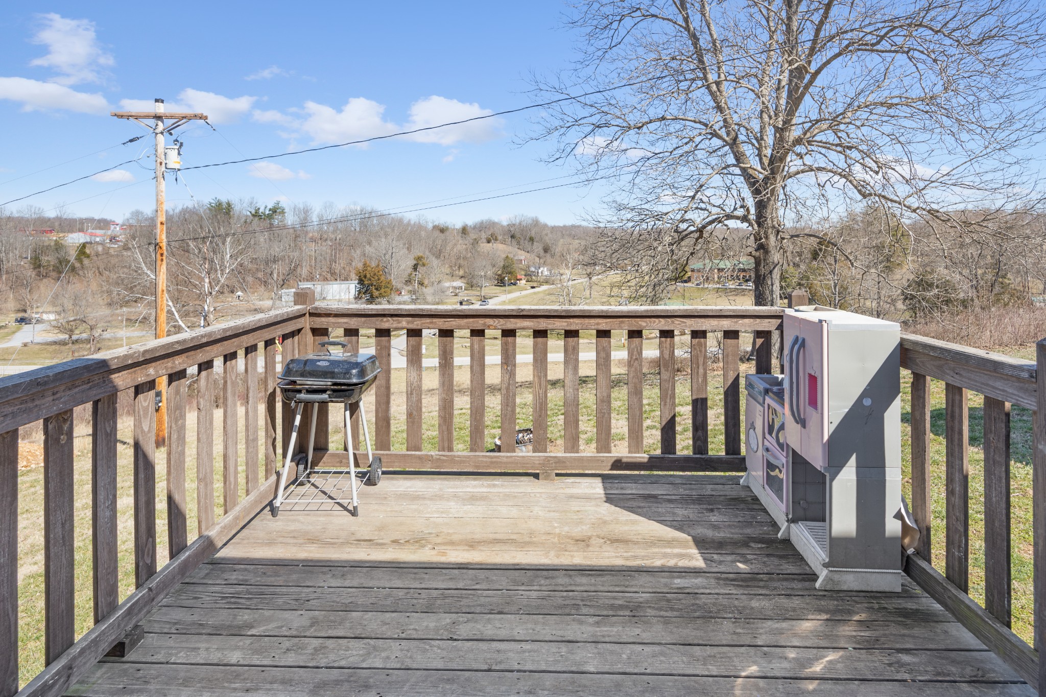 510 Highland Park Road Red Boiling Springs, TN 37150 - Photo 20 of 21 a view of a balcony with wooden floor and fence