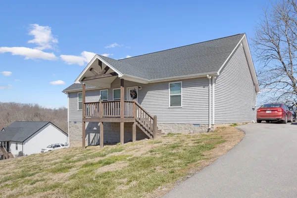 a view of a house with a sink and yard