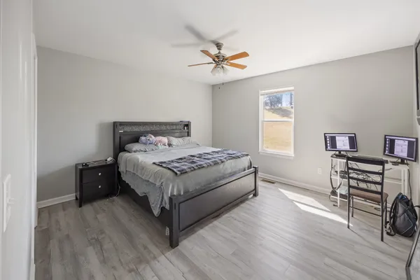 a bedroom with a bed and a table