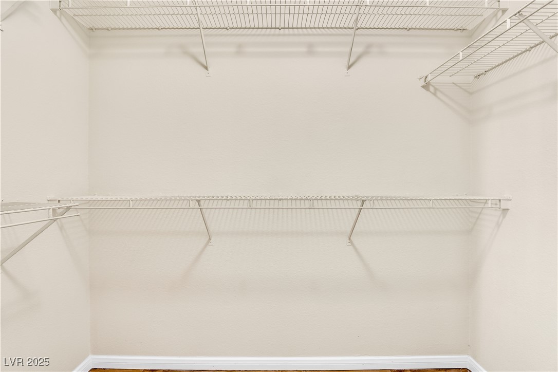 2300 East Silverado Ranch Boulevard, Unit 2003 Las Vegas, NV 89123 - Photo 12 of 19 Walk in closet featuring wood finished floors