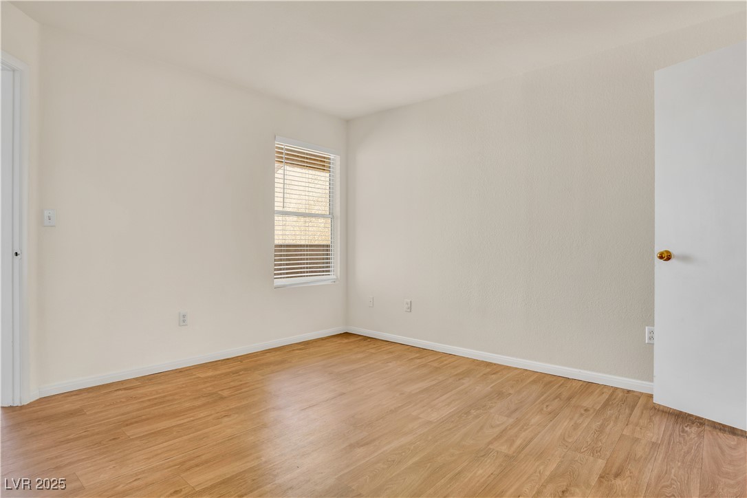 2300 East Silverado Ranch Boulevard, Unit 2003 Las Vegas, NV 89123 - Photo 14 of 19 Unfurnished room featuring light wood finished floors