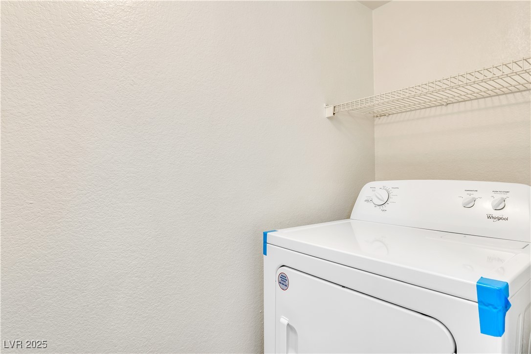 2300 East Silverado Ranch Boulevard, Unit 2003 Las Vegas, NV 89123 - Photo 18 of 19 Laundry area featuring washer / dryer