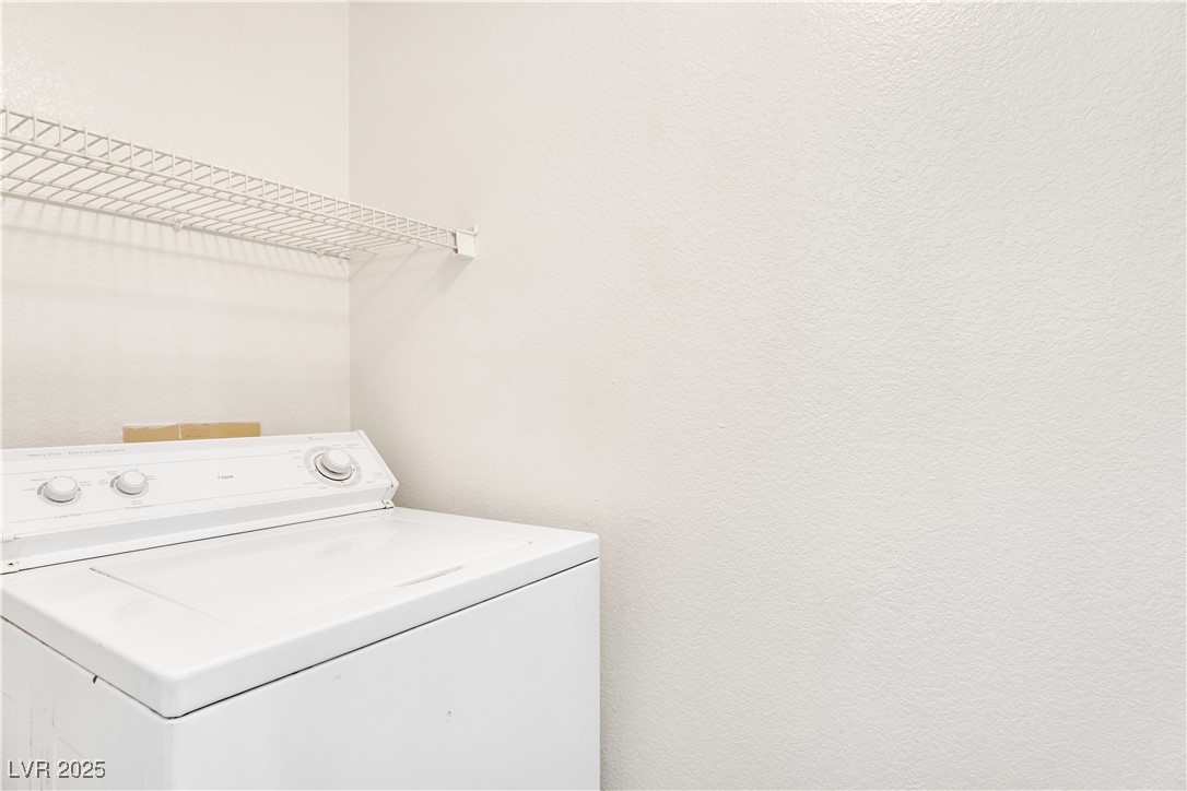 2300 East Silverado Ranch Boulevard, Unit 2003 Las Vegas, NV 89123 - Photo 19 of 19 Laundry room with washer / dryer