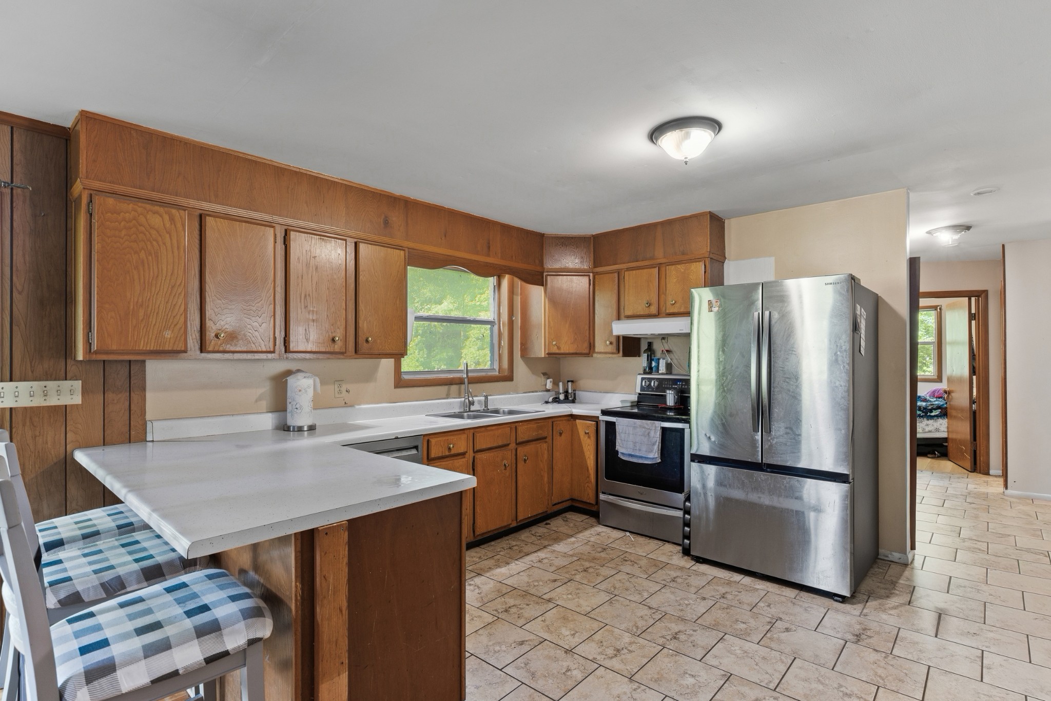 2262 Pleasant View Road Pleasant View, TN 37146 - Photo 6 of 25 a kitchen with a refrigerator a stove a sink and a microwave