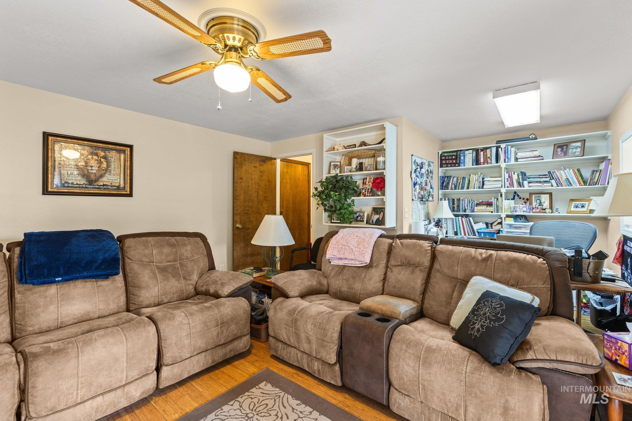 7567 Sundance Drive Boise, ID 83709 - Photo 16 of 21 Living room with wood finished floors and a ceiling fan