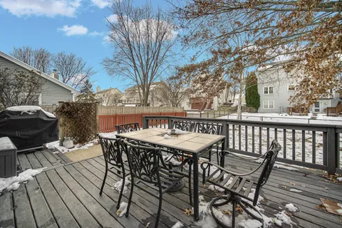 a view of a chairs and table on the deck
