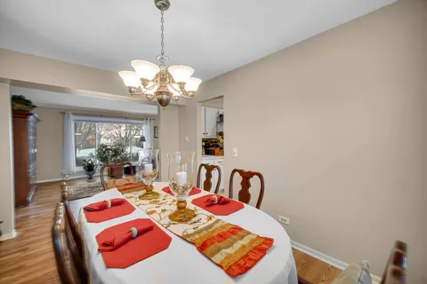a bedroom with furniture and a chandelier