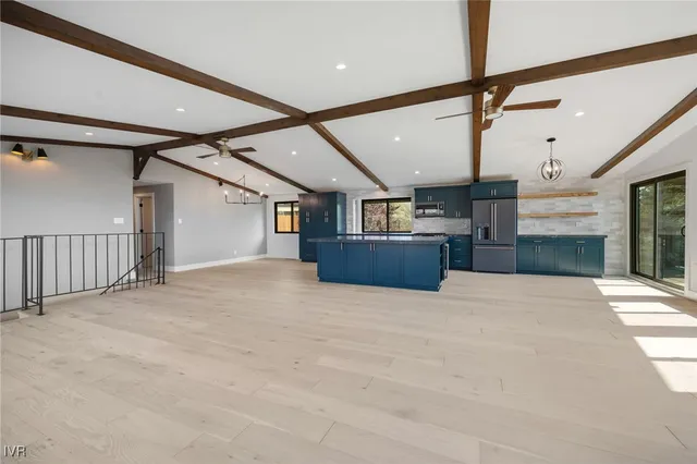 a view of an empty room with stairs