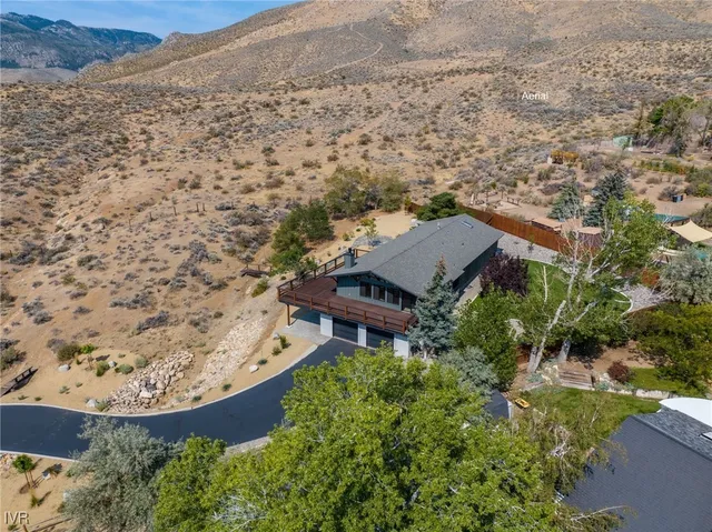 an aerial view of house with yard