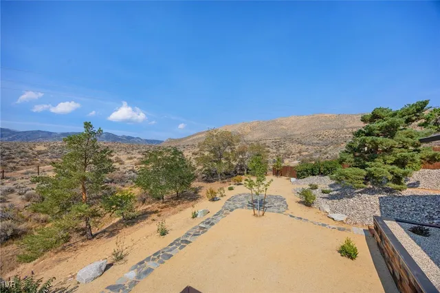 a view of a swimming pool with a lounge chairs